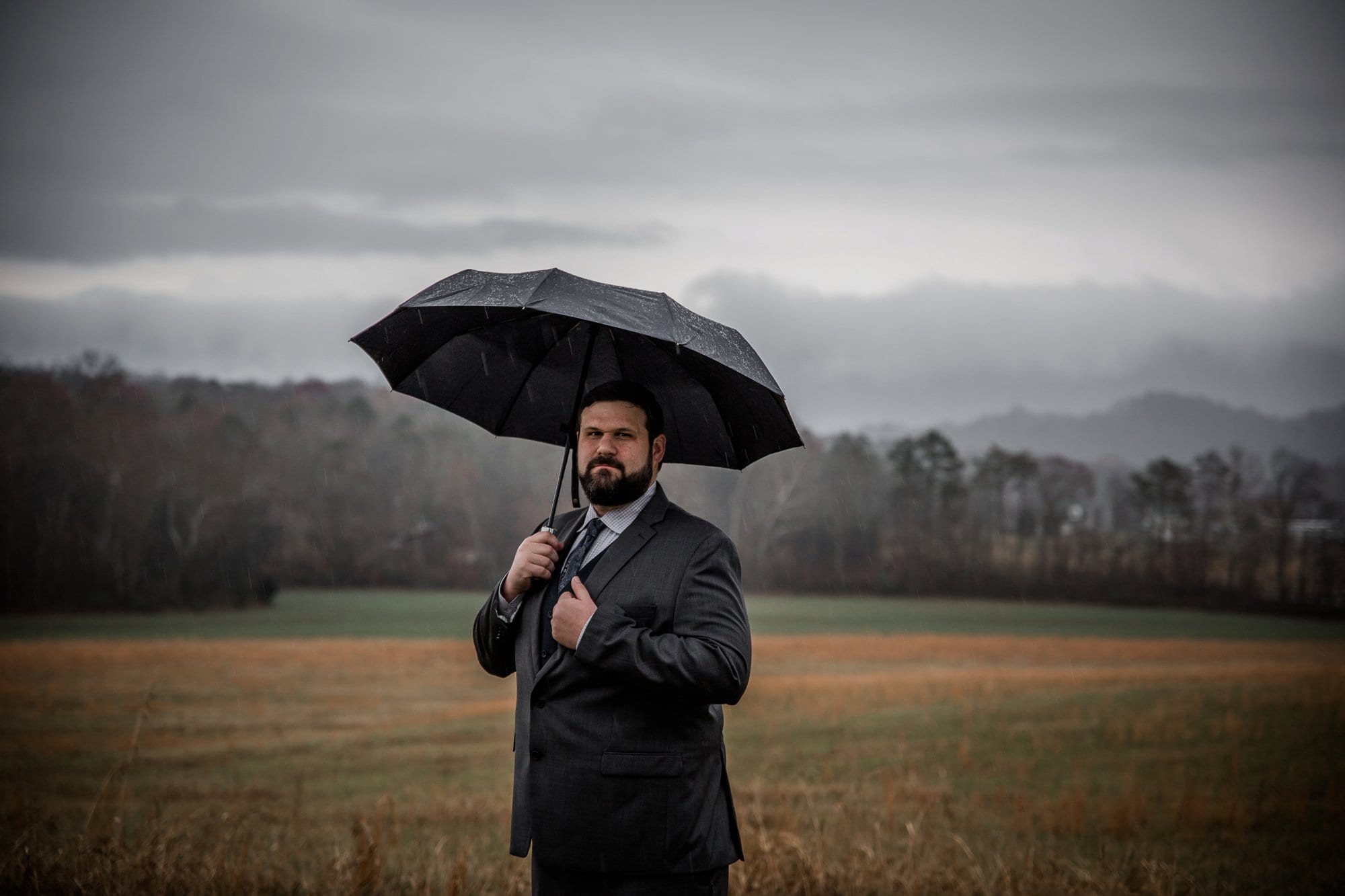 Groom on a rainy day at a wedding in the Smokey Mountains