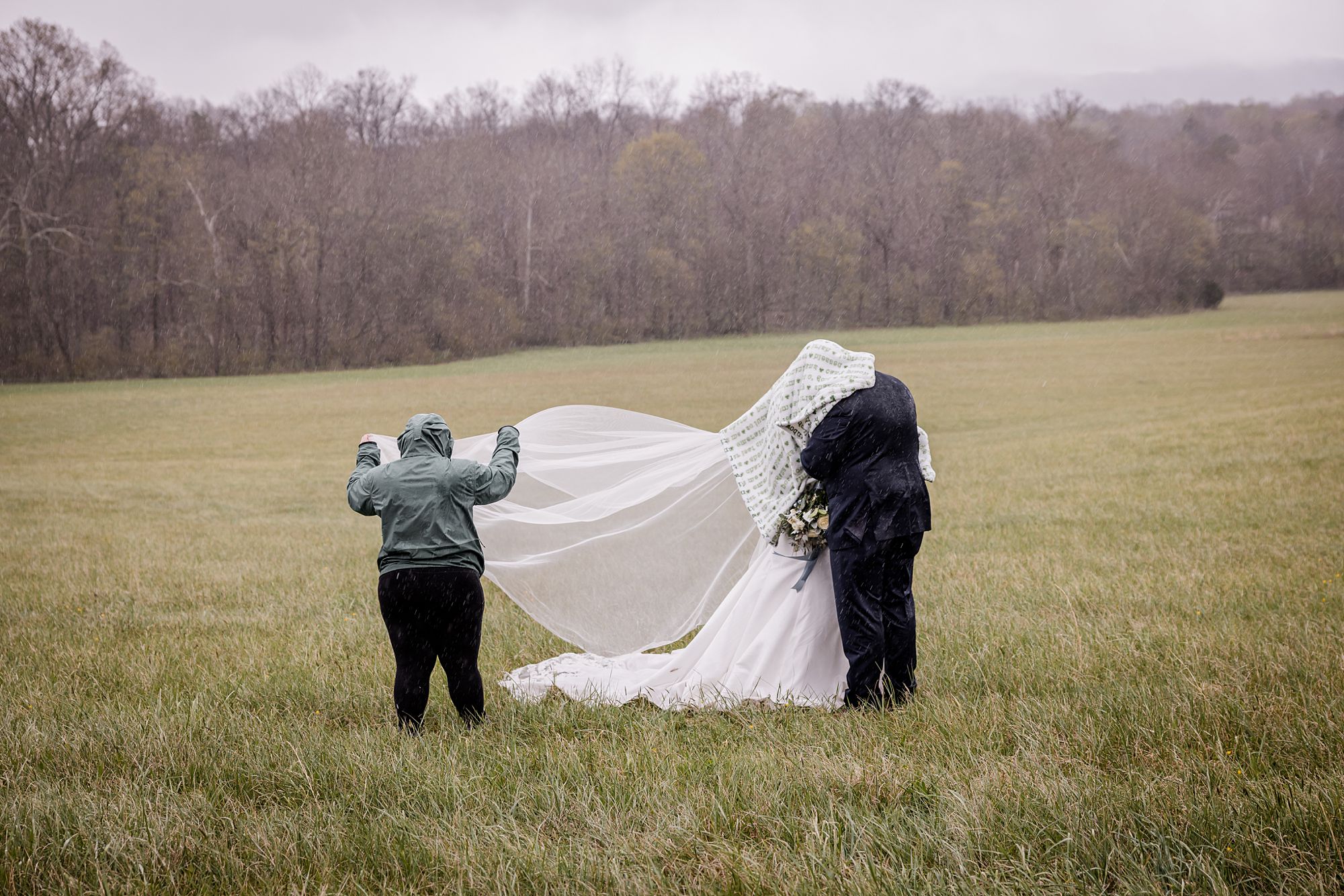 Rainy day photographer bridal portrait with a veil