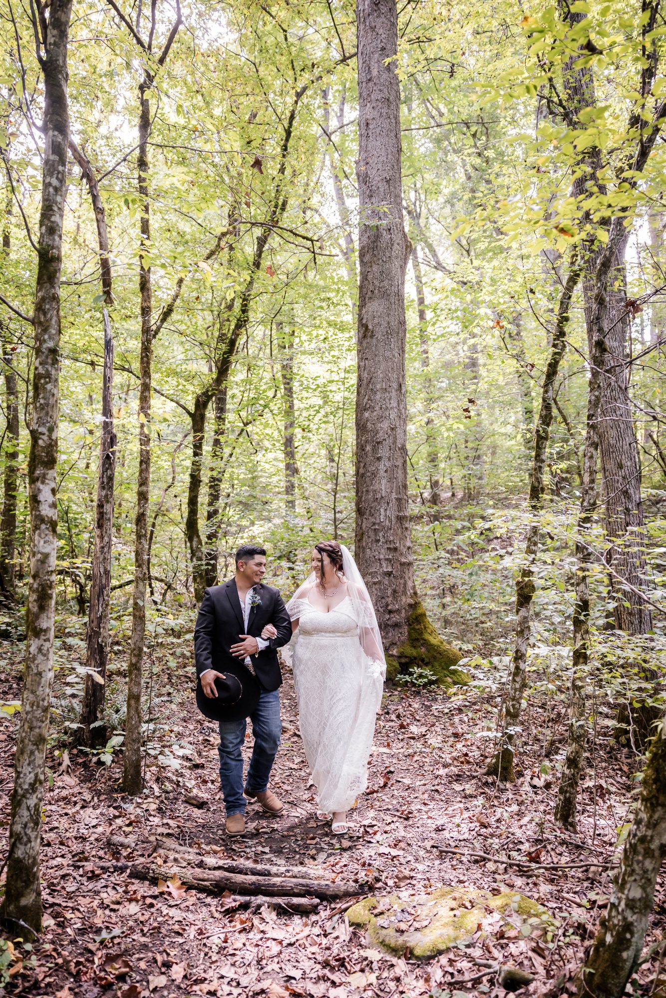 Walk in the woods bride and groom portrait
