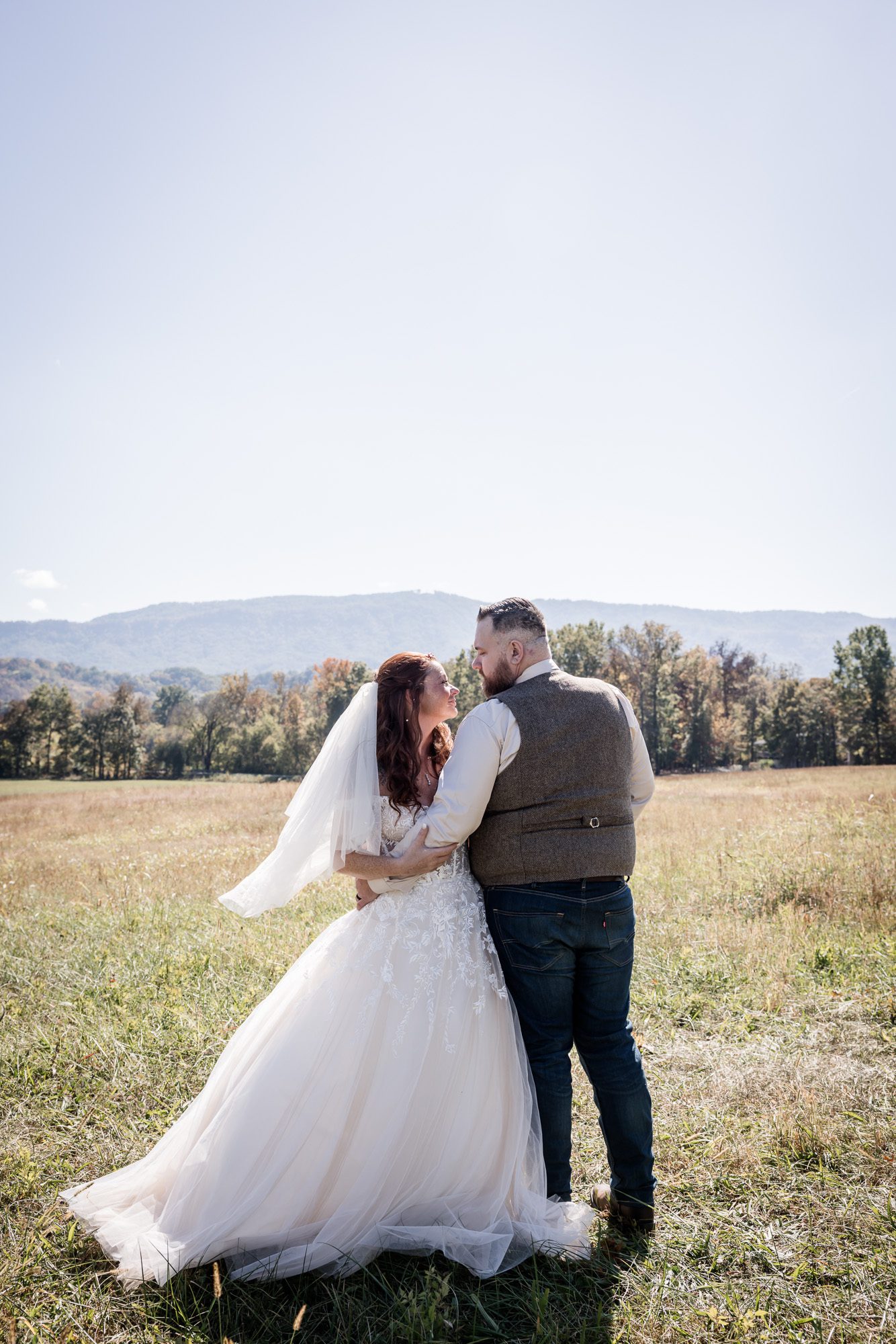 field bride and groom portrait