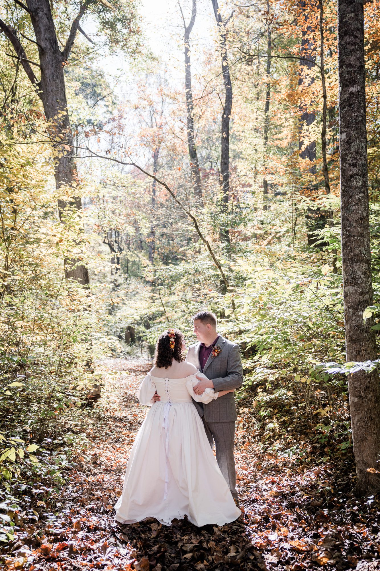 Glowing forest bride and groom portrait