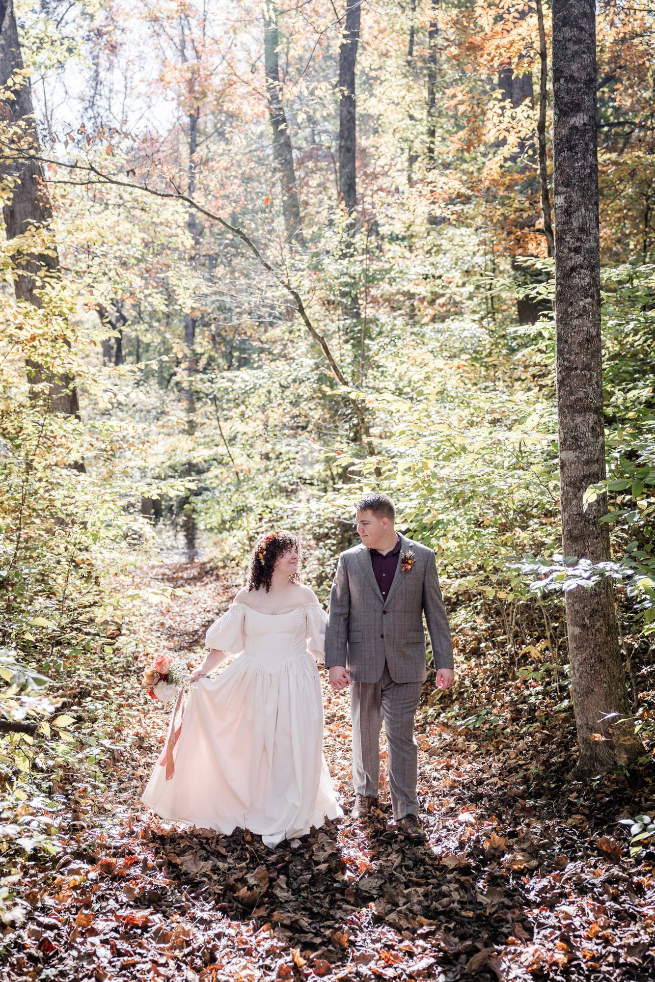 Fall forest bride and groom portrait
