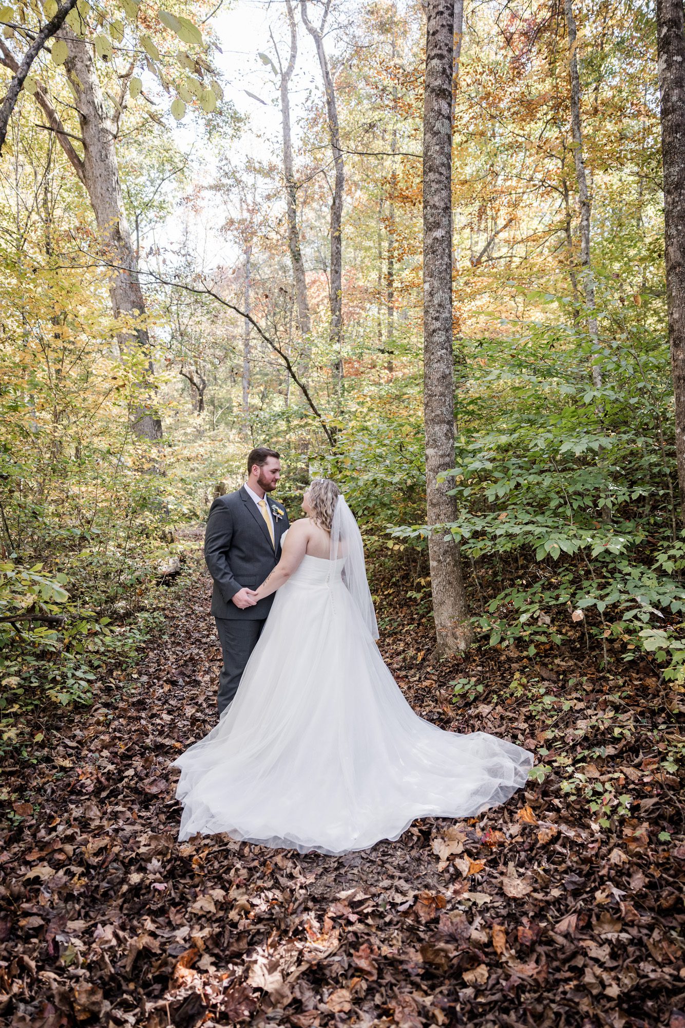Fall forest bride and groom portrait