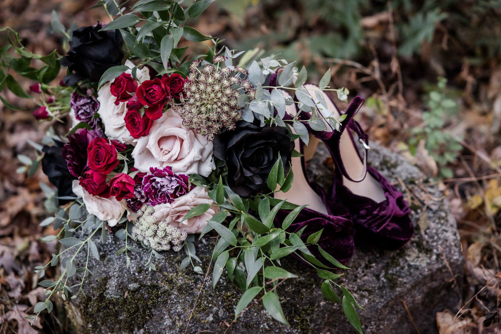 Moody bouquet and wedding shoes