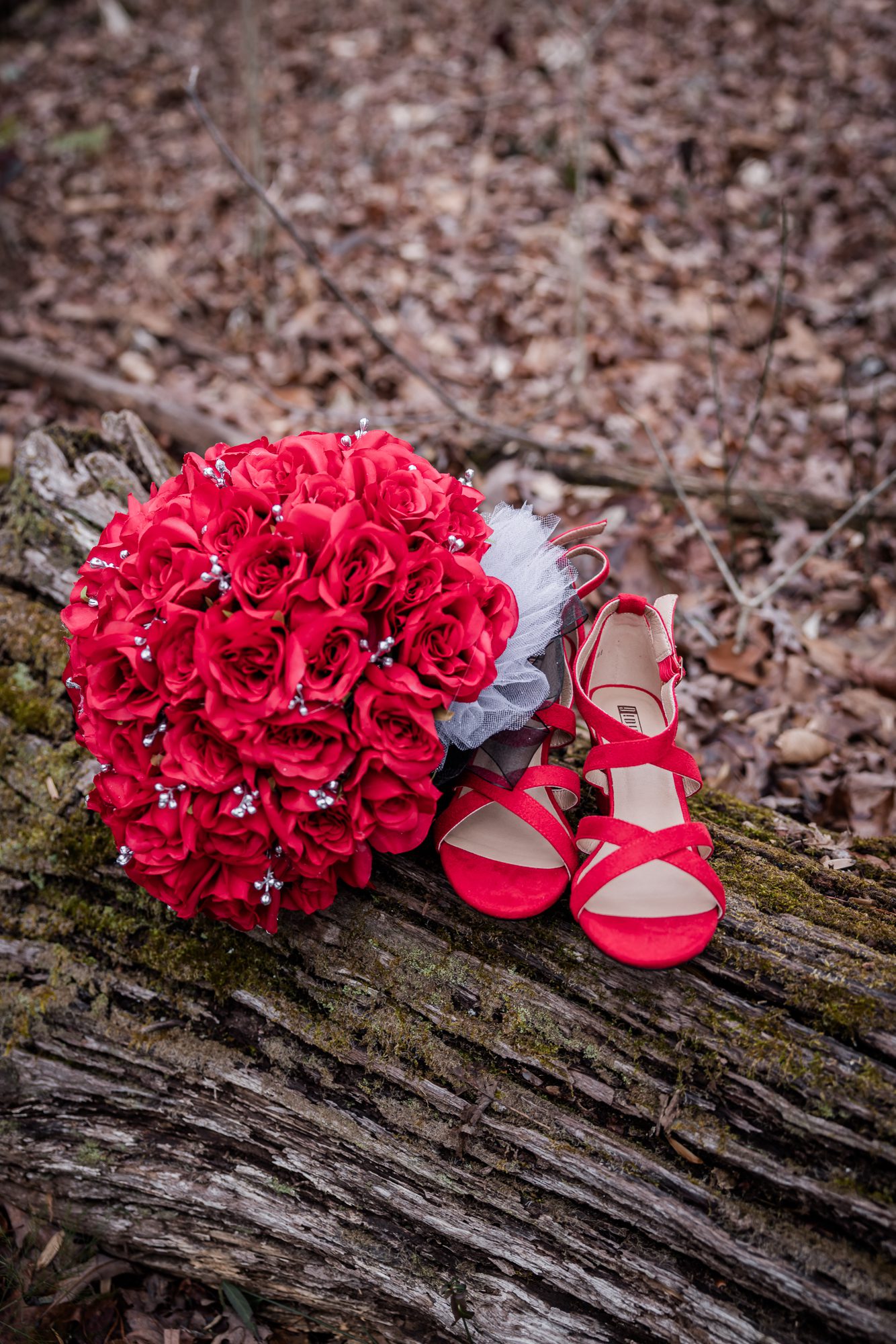 Red rose bouquet and wedding shoes